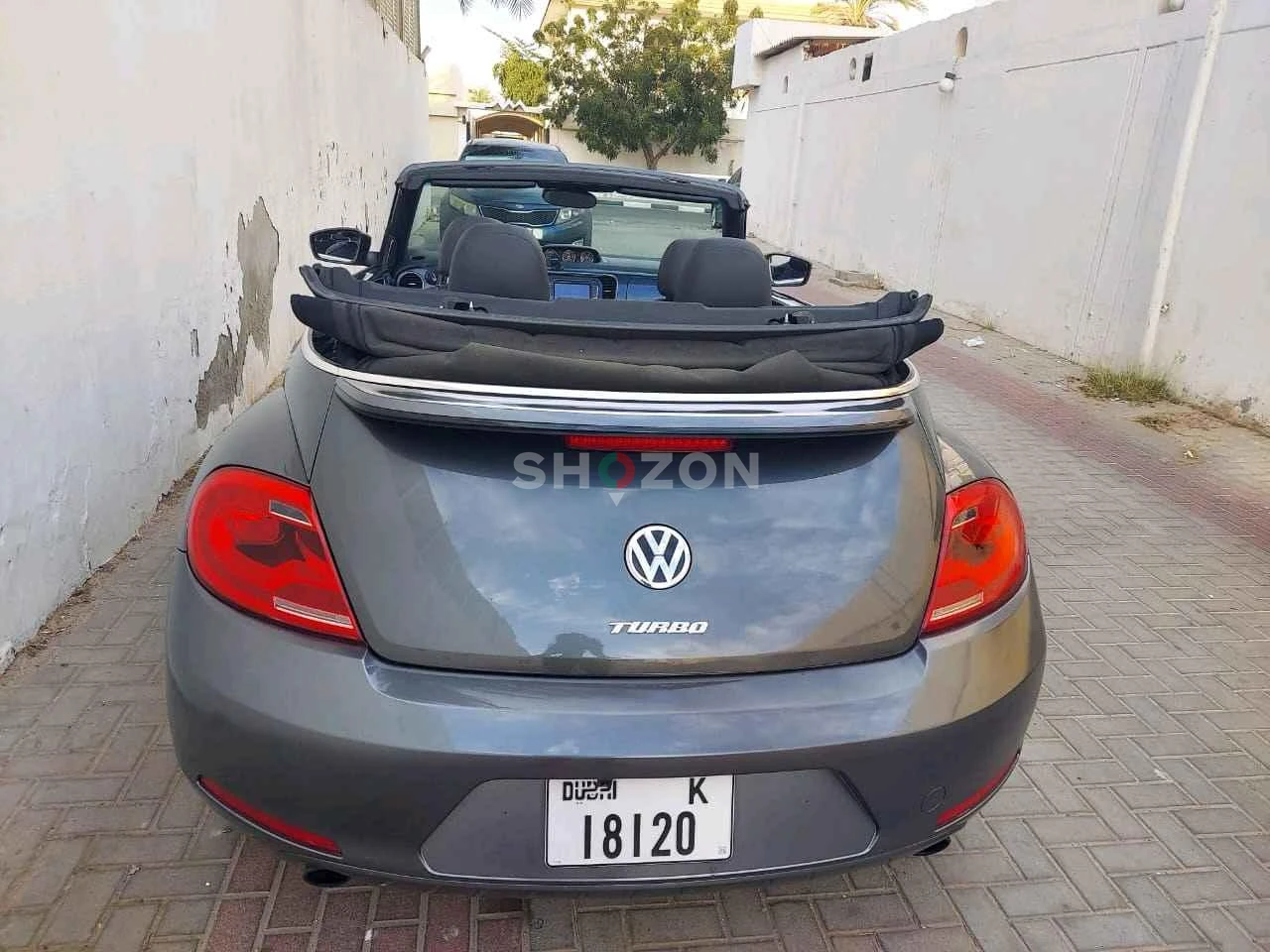 Volkswagen Beetle convertible featuring a sleek black