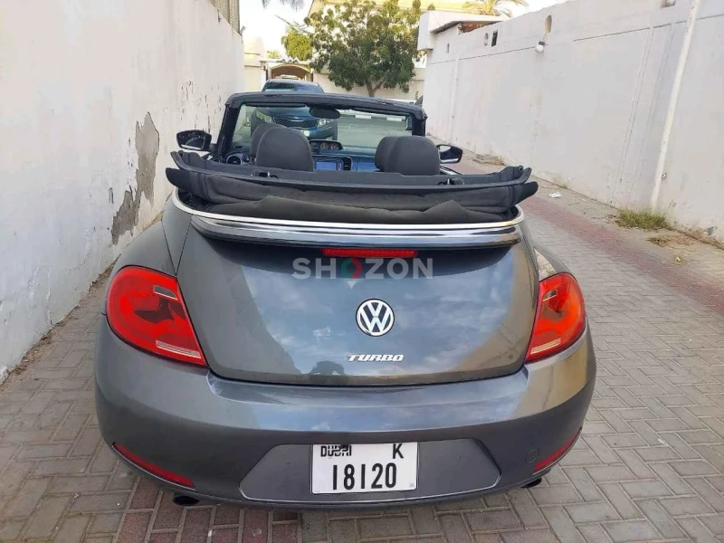 Volkswagen Beetle convertible featuring a sleek black