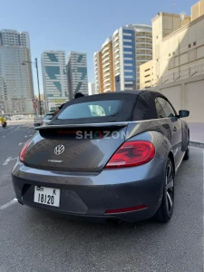 Volkswagen Beetle convertible featuring a sleek black