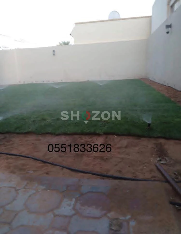 Green Lawn with Sprinkler System