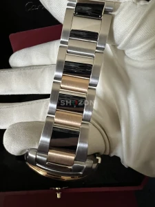 cartier calibre gold and steel