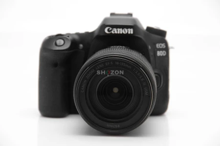 Canon EOS 80D with 18-135mm Lens + Charger Strap, and more accessories.
