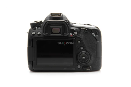 Canon EOS 80D with 18-135mm Lens + Charger Strap, and more accessories.