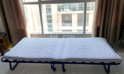 Foldable single guest bed with mattress - good condition