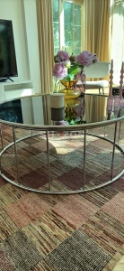 Stylish Round Coffee Table with Floral Arrangement