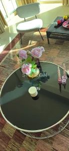 Stylish Round Coffee Table with Floral Arrangement