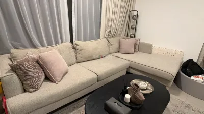 Modern L-shaped beige sectional sofa